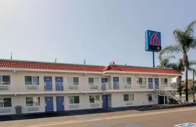 a hotel with a sign on the side of it at Motel 6-La Mesa, CA - San Diego in La Mesa