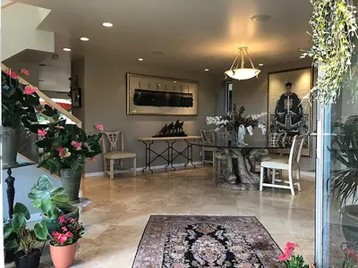 a living room with a table and chairs and plants at Rent Laguna Beach Sanctuary in Laguna Beach