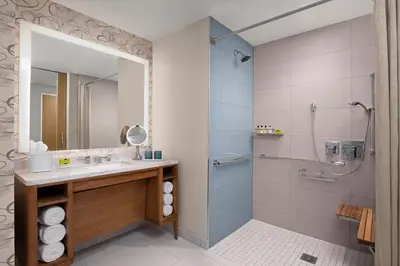 a bathroom with a sink and a shower at InterContinental San Diego by IHG in San Diego