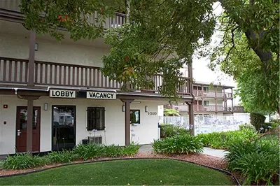 a building with a sign in front of it at EZ 8 Motel Old Town in San Diego