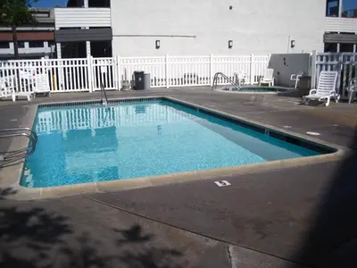 an empty swimming pool in a parking lot at EZ 8 Motel Old Town in San Diego