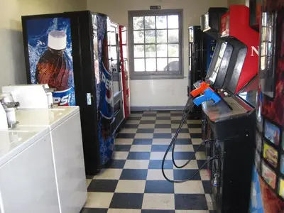 a room with a soda machine and a video game at EZ 8 Motel Old Town in San Diego