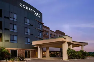 a rendering of the front of a hotel at Courtyard by Marriott San Diego Oceanside in Oceanside
