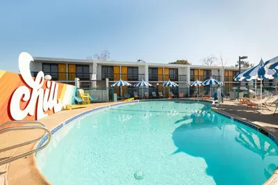 a large swimming pool in front of a hotel at Rambler Hotel in Chula Vista
