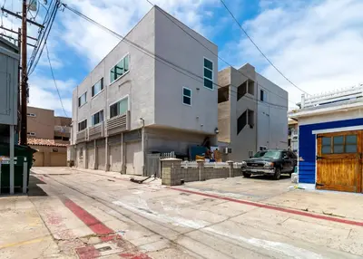 a building under construction on a city street at Fantastic Mission Beach condo steps to the Beach in San Diego