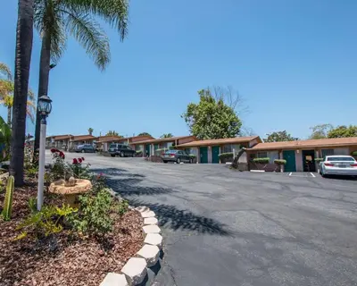 a parking lot in front of a motel at Rodeway Inn Fallbrook Downtown in Fallbrook
