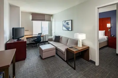 a hotel room with a couch and a bed and a desk at Residence Inn by Marriott San Juan Capistrano in San Juan Capistrano