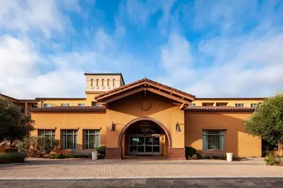 an office building with a blue sky in the background at Residence Inn by Marriott San Juan Capistrano in San Juan Capistrano