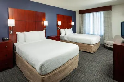 a hotel room with two beds and a television at Residence Inn by Marriott San Juan Capistrano in San Juan Capistrano