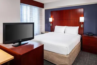 a hotel room with a bed and a flat screen tv at Residence Inn by Marriott San Juan Capistrano in San Juan Capistrano