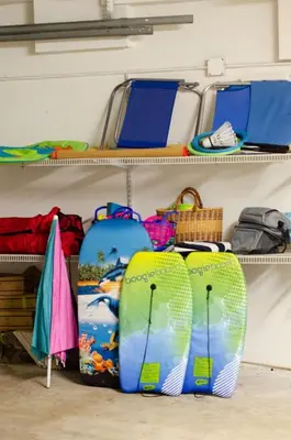 a room with shelves with surfboards and other items at Luxury Retreat • Hot Tub FirePit Panoramic Views in San Diego