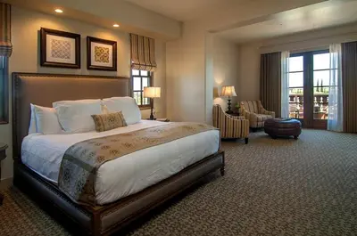 a bedroom with a large bed in a hotel room at Ponte Vineyard Inn in Temecula