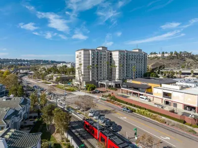an aerial view of a city with a red bus at DoubleTree by Hilton San Diego-Mission Valley in San Diego