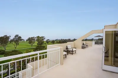 a balcony with a view of a golf course at Hilton La Jolla Torrey Pines in San Diego