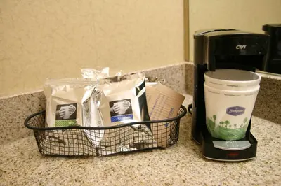 a basket sitting on a counter next to a coffee maker at Hampton Inn San Marcos in San Marcos
