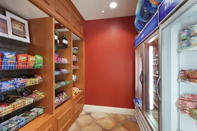 a walk in pantry with a red wall at Hilton Garden Inn Carlsbad Beach in Carlsbad