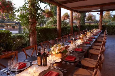 a long table with chairs and wine bottles on it at South Coast Winery Resort & Spa in Temecula