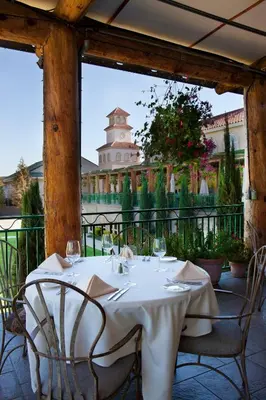 a table with wine glasses on a patio at South Coast Winery Resort & Spa in Temecula