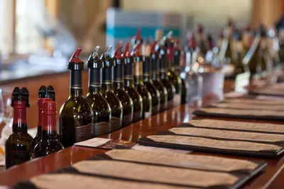 a bunch of bottles of wine sitting on a table at South Coast Winery Resort & Spa in Temecula