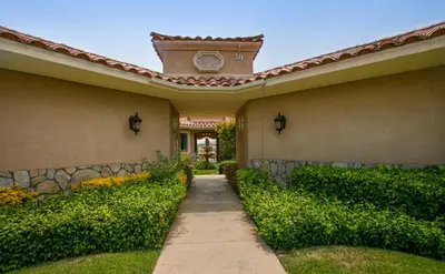 a house with a pathway leading to the front yard at South Coast Winery Resort & Spa in Temecula