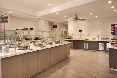 a large kitchen with many pots and pans on a counter at Embassy Suites by Hilton Temecula Valley Wine Country in Temecula