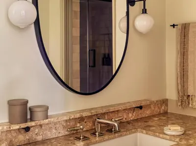 a bathroom with a sink and a mirror at Casa Loma Beach Hotel in Laguna Beach