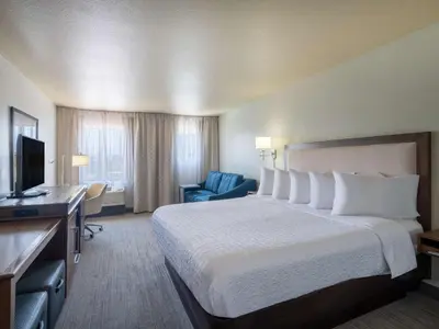 a hotel room with a large bed and a television at Hampton Inn by Hilton Irvine East - Lake Forest in Foothill Ranch