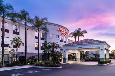 a hotel with a sign on the front of it at Hampton Inn by Hilton Irvine East - Lake Forest in Foothill Ranch