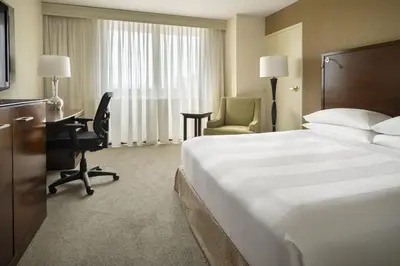 a hotel room with a large bed and a desk at San Diego Marriott La Jolla in San Diego
