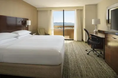 a hotel room with a large bed and a desk at San Diego Marriott La Jolla in San Diego