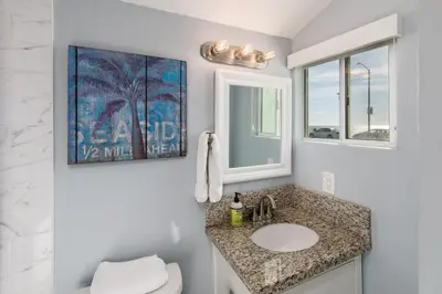 a bathroom with a sink and a mirror at Pacific Bungalow in Oceanside with Backyard & Tiny House in Oceanside