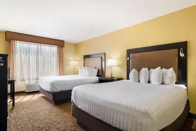 a hotel room with two beds and a window at Best Western Escondido Hotel in Escondido
