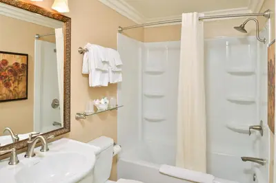 a bathroom with a sink and a shower at Dana Point Marina Inn in Dana Point