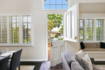 a living room with a couch and a window at 416 Dahlia in Newport Beach
