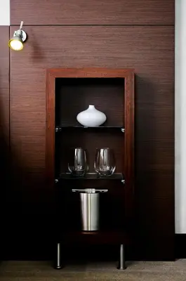 a shelf with two wine glasses and a pot at Hercor Hotel - Urban Boutique in Chula Vista