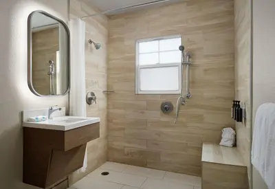 a bathroom with a sink and a shower at Diamond Head Inn in San Diego