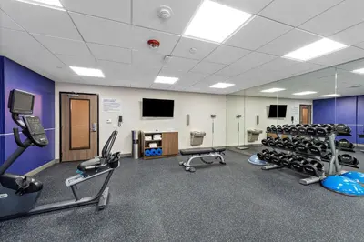 a gym with treadmills and machines in a room at Holiday Inn Express La Mesa Near SDSU by IHG in La Mesa