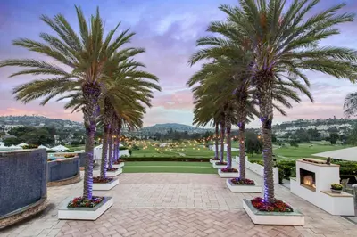 a row of palm trees on a golf course at Omni La Costa Resort & Spa Carlsbad in Carlsbad