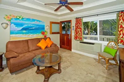 a living room with a couch and a table at Ocean Palms Beach Resort in Carlsbad