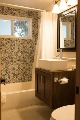 a bathroom with a sink and a mirror at Apple Tree Inn in Julian