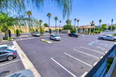 an aerial view of a parking lot with cars parked at Motel 6-Menifee, CA in Menifee