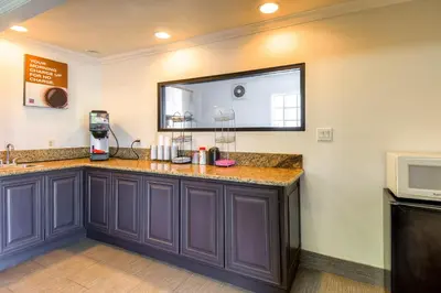 a kitchen with purple cabinets and a window at Motel 6-Menifee, CA in Menifee