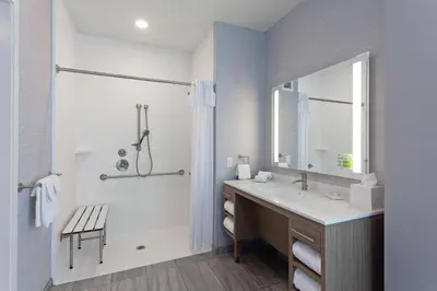 a white bathroom with a sink and a shower at Home2 Suites By Hilton Temecula in Temecula