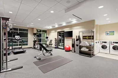 a gym with exercise equipment in a building at Home2 Suites By Hilton Temecula in Temecula