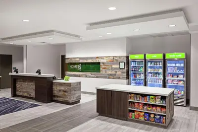 a store with two refrigerators and a counter with drinks at Home2 Suites By Hilton Temecula in Temecula