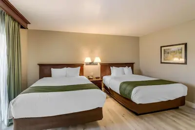 a hotel room with two beds and a window at Quality Inn & Suites El Cajon San Diego East in El Cajon