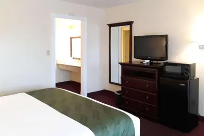a hotel room with a bed and a television at Quality Inn & Suites El Cajon San Diego East in El Cajon