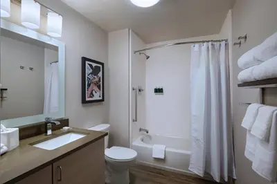 a bathroom with a toilet sink and a shower at TownePlace Suites by Marriott San Diego Airport/Liberty Station in San Diego