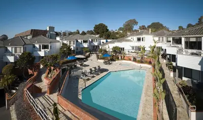 an overhead view of a swimming pool in a apartment complex at Hotel Indigo San Diego Del Mar by IHG in San Diego