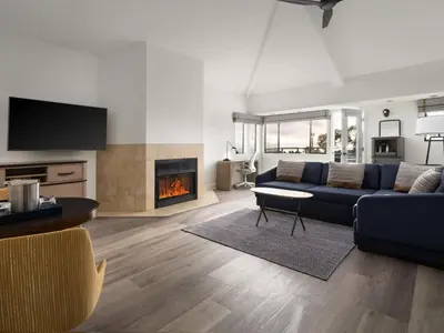 a living room with a couch and a fireplace at Hotel Indigo San Diego Del Mar by IHG in San Diego